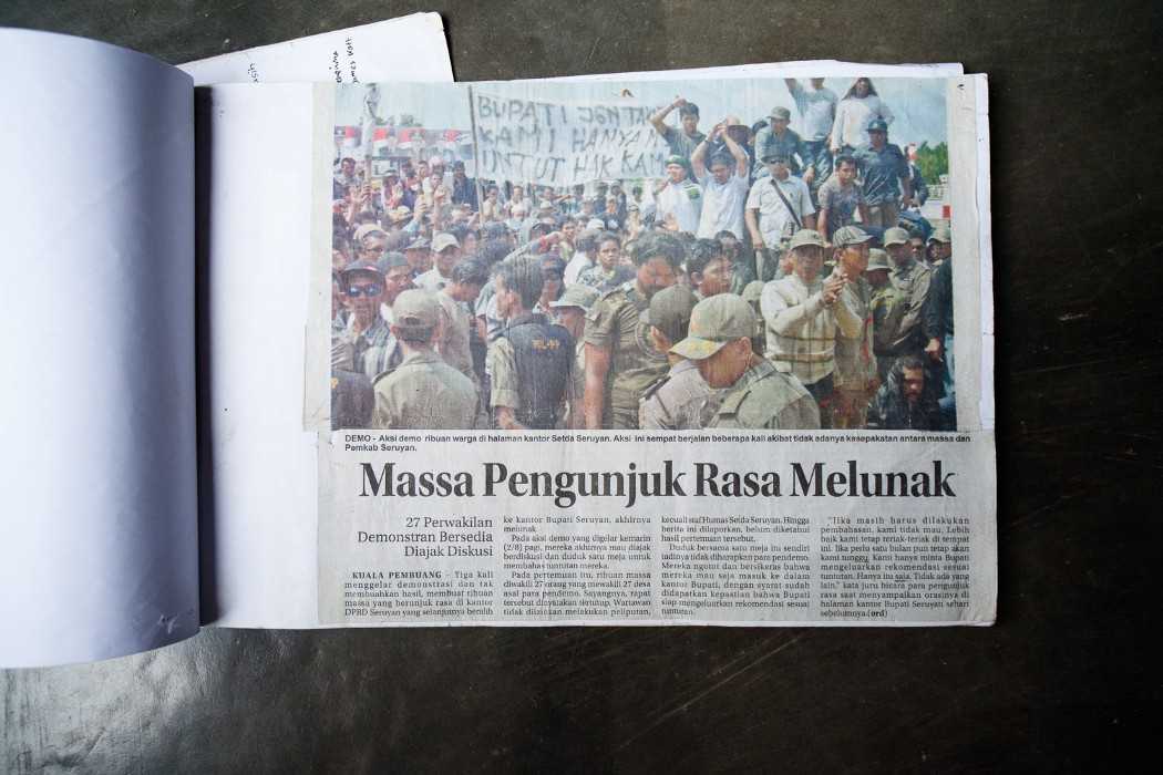 A newspaper clipping from the 2011 protest. The banner reads, “Bupati don’t be afraid we only demand our rights.”