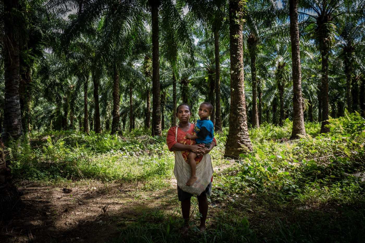 Angelina Ketang, 29, works as a labourer in an oil palm plantation.